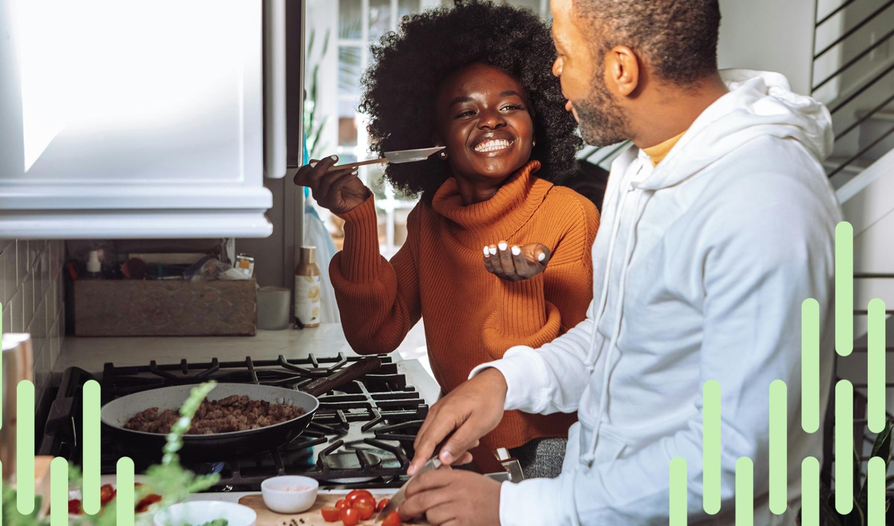 a man and a woman cooking in a kitchen